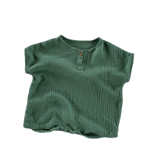 Dark green breathable muslin cotton baby romper with buttons on a plain white background