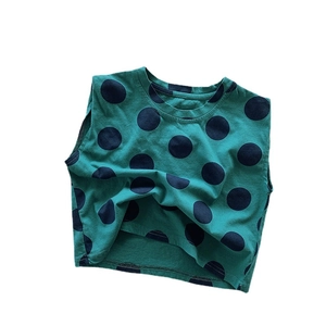 Dark green kids cotton tank top with navy blue polka dot print in casual summer style