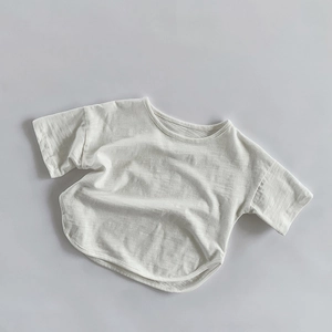 Detail of bamboo slub cotton T-shirt with curved hem and breathable texture