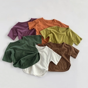 Detail view of multi-color slub cotton t-shirts with curved hem and drop shoulder design