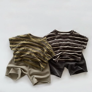 Flat lay of kids summer retro striped T-shirt and solid cotton shorts sets