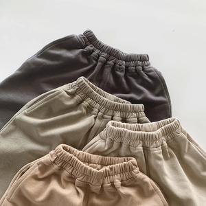 Close-up of kids sweatpants showing premium ribbed cotton texture and elastic waistband