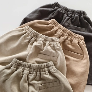 Detailed view of elastic waistbands and premium knit cotton fabric on kids shorts