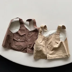 Kids minimalist cotton linen vest in brown and beige with pockets and button detail