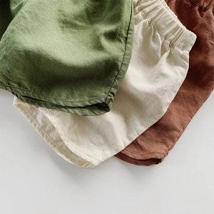 Kids breathable cotton linen shorts in green, beige and ochre with elastic waistband