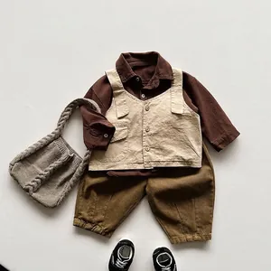 Kids vintage forest-style outfit with beige button vest and olive green casual pants