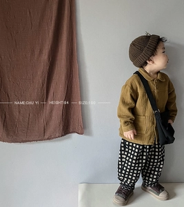 Detail view of mustard yellow double pocket cotton jacket and height chart for kids