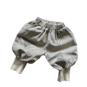Pantalon sarouel enfant en velours côtelé beige à imprimé géométrique et taille élastique