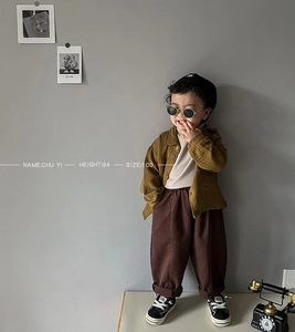 Detail view of mustard yellow cotton jacket and pants set for toddler boys and girls