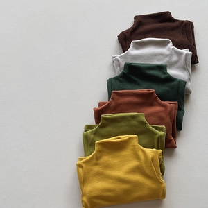 Detail view of multi-color ribbed turtleneck thermal shirts for kids in soft autumn tones