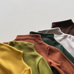 Close-up of diverse candy-colored thermal mock neck sweaters for toddlers and children