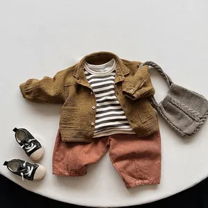 Toddler three-piece clothing set with mustard jacket, striped shirt, and trousers