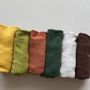Close-up of soft brushed velvet fabric textures in various vintage warm candy colors