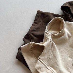 Detailed view of thick cotton blend fabric and ribbed collar on kids hooded vest