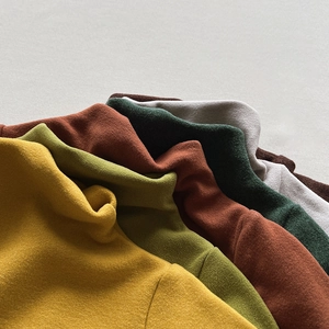 Close-up of thick thermal fleece base layers in vibrant colors for boys and girls