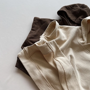 Kids hooded cotton vests in brown and beige showing premium fabric texture and seams