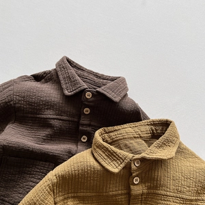 Close-up of double-layer cotton crepe fabric shirts with natural wood buttons and texture