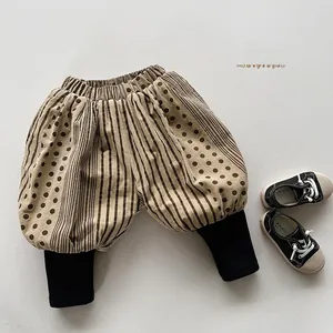 Detail view of kids khaki lantern pants with brown stripes and black ribbed cuffs
