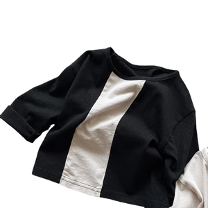 Kids long sleeve cotton T-shirt featuring minimalist black and white vertical patchwork