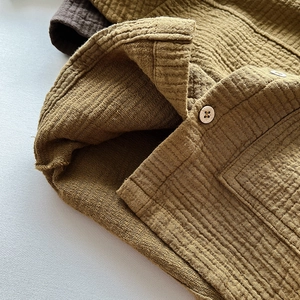 Kids mustard yellow double-layer cotton jacket with wooden buttons and waffle texture