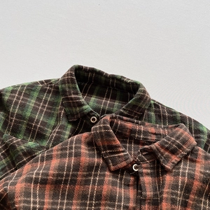 Kids long-sleeved plaid shirts in green and red flannel fabric with buttons