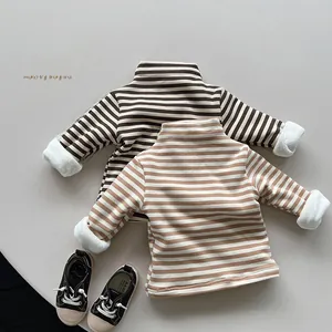 Detail of children striped thermal tops showing soft fleece lining and high collar