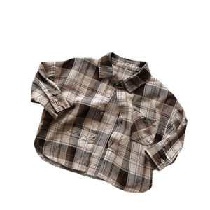 Kids vintage brown plaid flannel shirt with long sleeves and wooden buttons