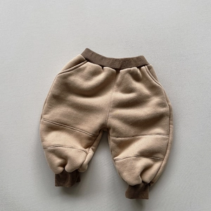 Detail of kids winter fleece joggers with contrast paneling and elastic ribbed cuffs