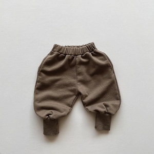 Close-up of coffee brown toddler jogger pants featuring ribbed cuffs and elastic waist