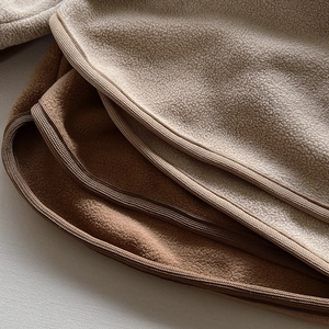 Soft thermal fleece base layer for children in oatmeal and brown with fine edge stitching