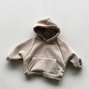 Detail view of khaki fleece hoodie for kids with kangaroo pocket and ribbed cuffs