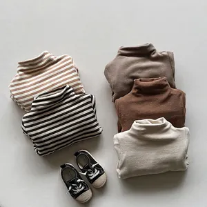 Cozy thermal fleece-lined turtleneck shirts for children in assorted earth tones