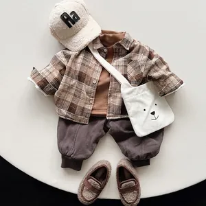 Kids vintage plaid flannel shirt set with brown trousers and plush accessories