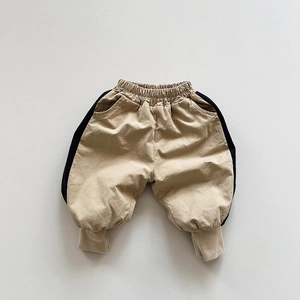 Detail of kids warm khaki fleece joggers with elastic waist and black side stripes