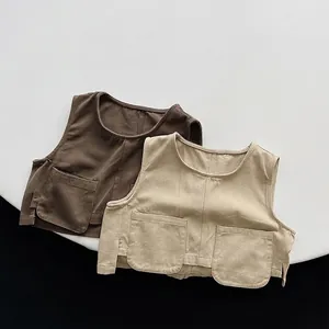 Kids vintage cotton canvas utility vest in dark brown and beige with large pockets