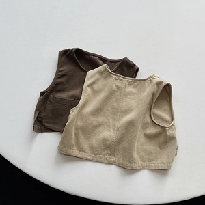 Detail view of retro cotton vests for kids in brown and khaki with washed texture