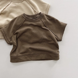 Detailed view of kids vintage cotton sweatshirts with raw-edge seams and ribbed texture