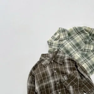 Detailed flat lay of long-sleeve plaid shirts in sage green and retro coffee cotton fabric
