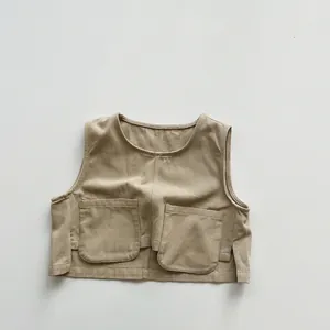 Detail view of khaki cotton canvas vest with utility pockets and side slit for toddlers