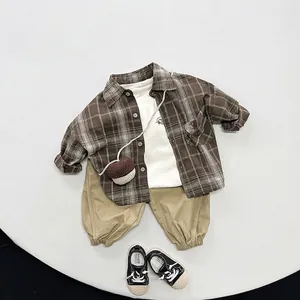 Kids vintage plaid shirt and khaki joggers set with white t-shirt for spring and autumn