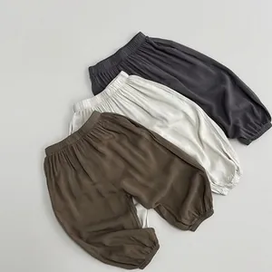 Detailed close-up of elastic waistband and hem on children's breathable cotton linen pants