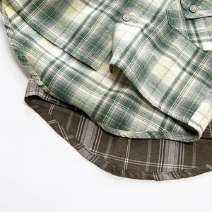 Classic kids plaid cotton shirt with green and brown checkered pattern and curved hem