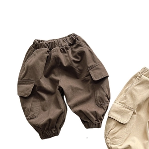 Vintage style cotton cargo pants for kids in brown and beige with elastic waist and pockets