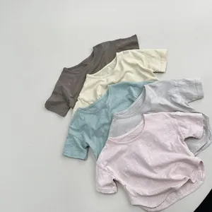 Detail of breathable slub cotton fabric on kids lightweight t-shirts in various colors