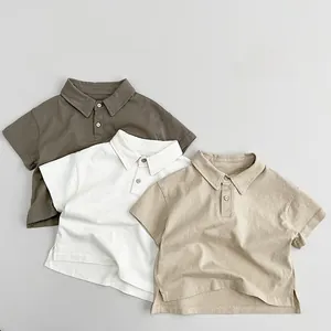 Detail of pure cotton polo shirts featuring classic collars and side slit hems in neutral tones