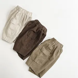 Detailed view of kids cargo shorts in cotton linen fabric with side utility pockets