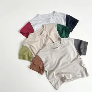 Close-up of three kids' raglan t-shirts with contrast sleeves in soft knitted cotton
