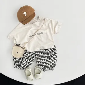 Toddler girl summer linen outfit set with beige Gummy Bear tee and patterned harem pants