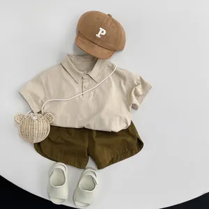 Kids vintage cotton shorts set with beige polo shirt and olive green shorts outfit
