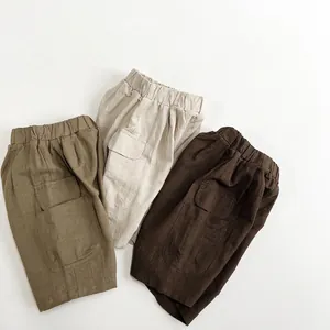 Kids cotton linen cargo shorts in beige and khaki colors with elastic waist and side pockets
